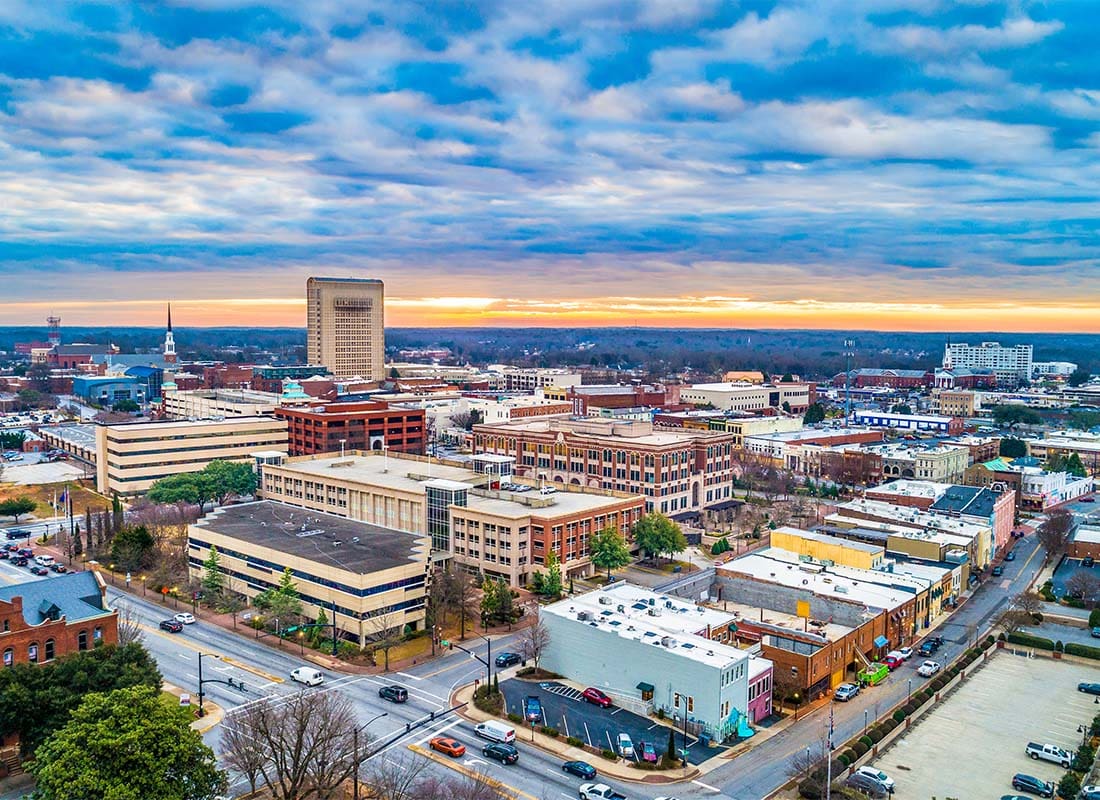 Spartanburg, SC - Aerial View of Downtown Spartanburg South Carolina with a Colorful Sunset Sky